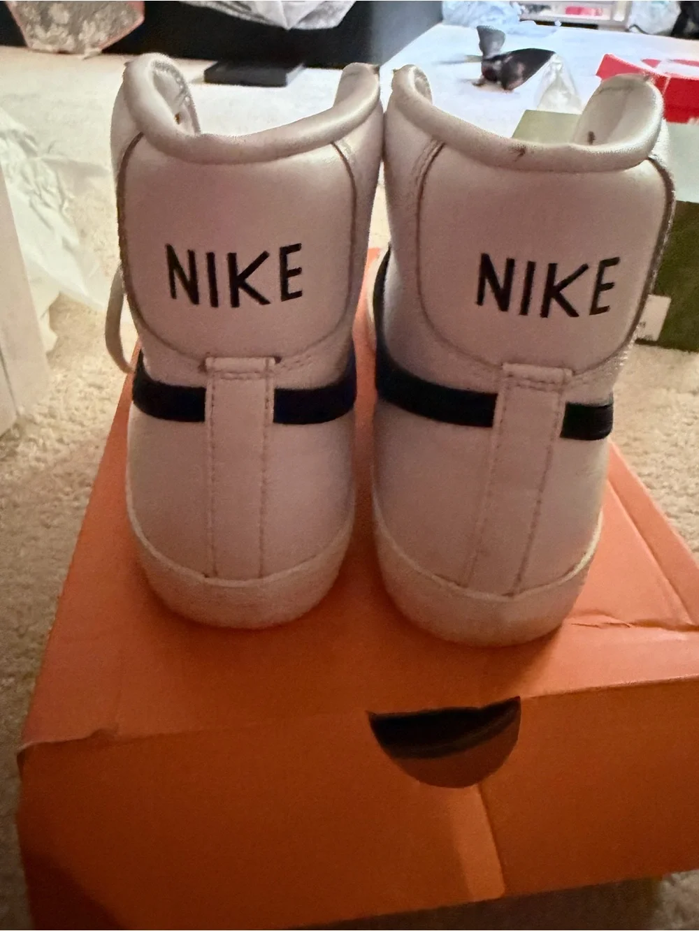Nike Women’s White High-Top Sneakers with Black Swoosh and Yellow Tongue Accent